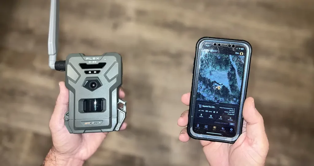 The Spypoint Flex G36 trail camera and its app on an iphone.