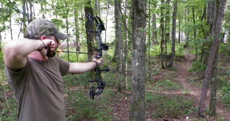 The author practicing shooting his bow in the heat of summer.